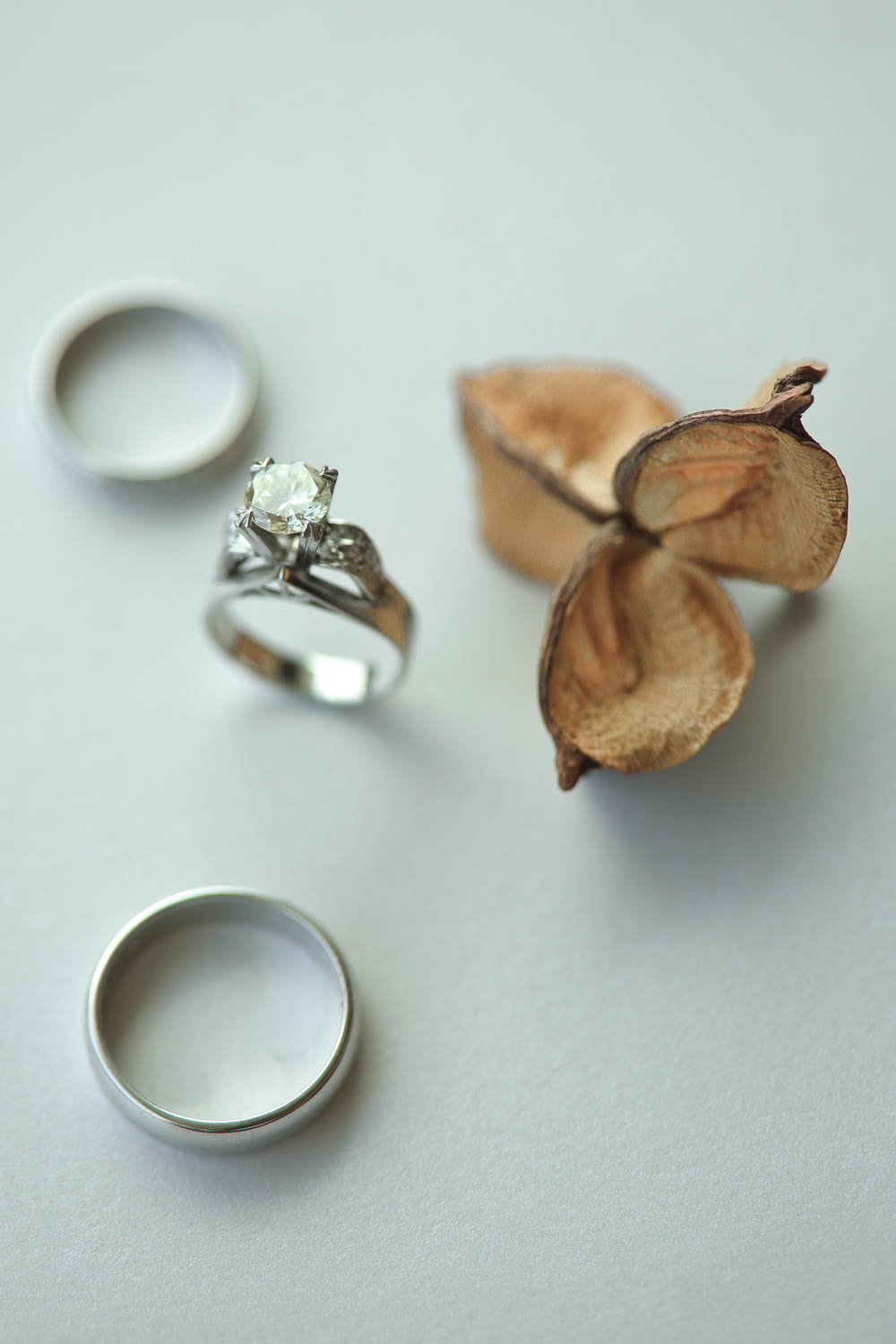 silver ring beside brown nuts