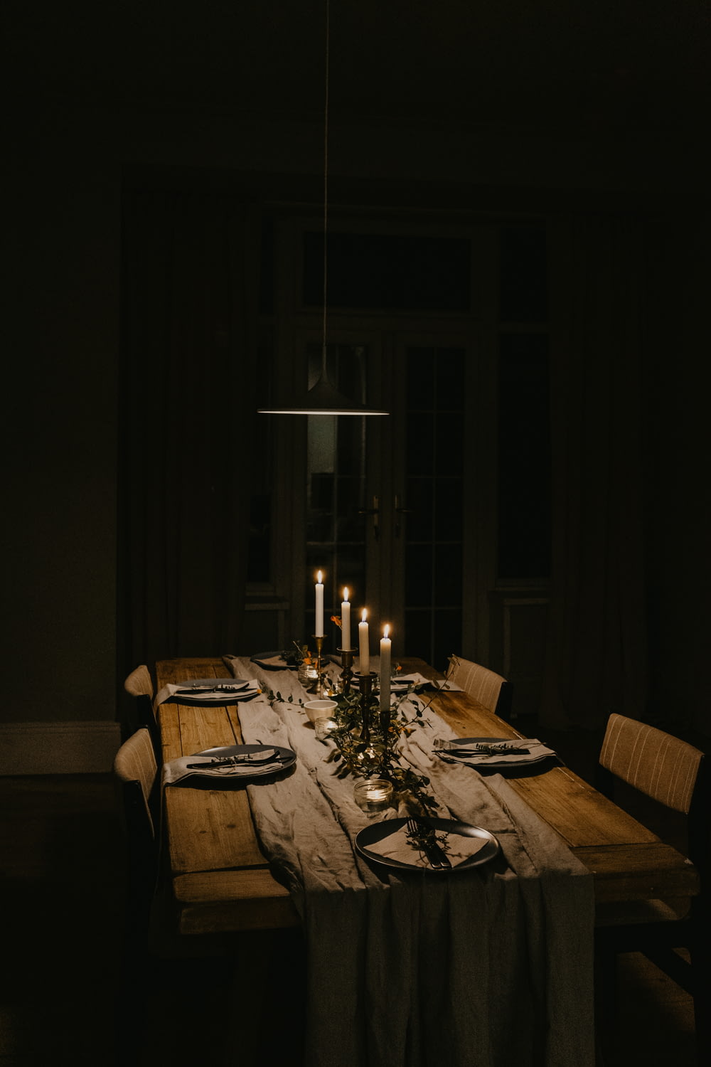 lighted candles on dining table