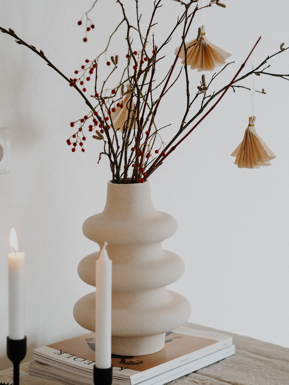 white ceramic vase with candles