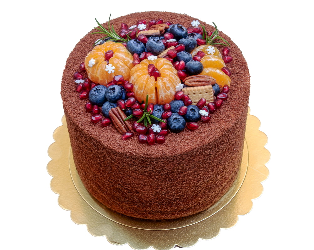 brown cake with assorted color candies