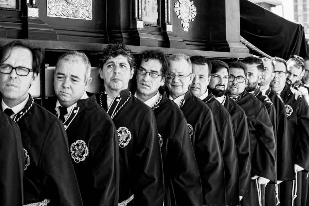 group of men in black robe
