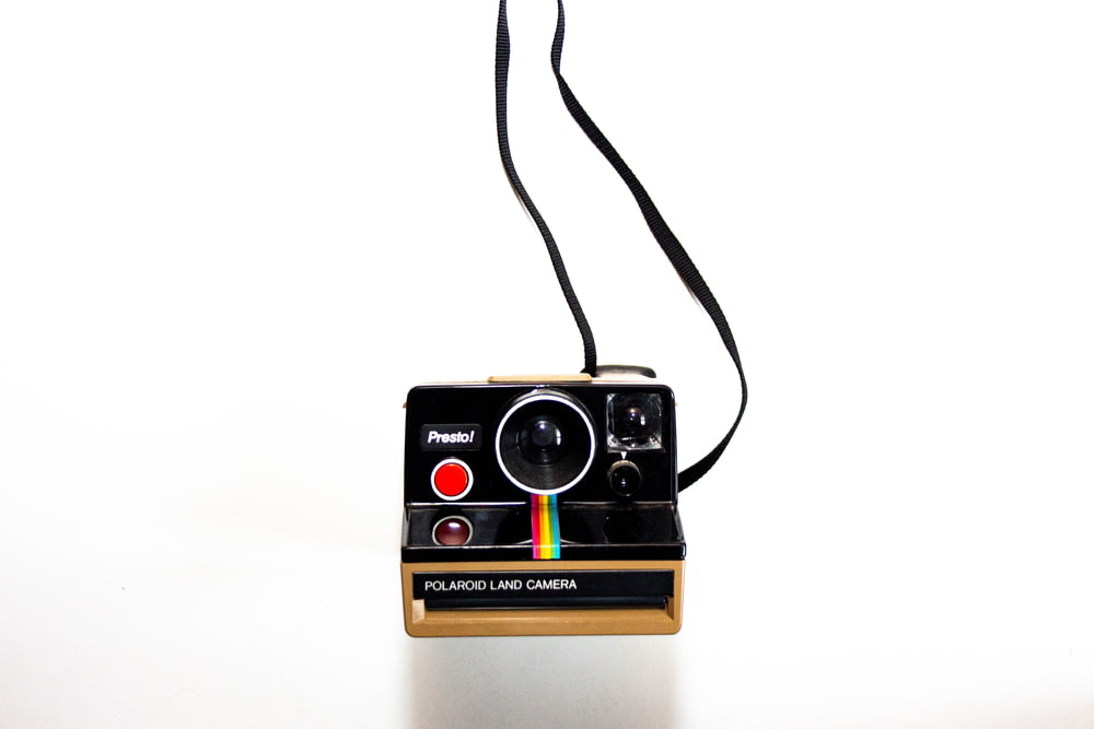 brown and black polaroid camera