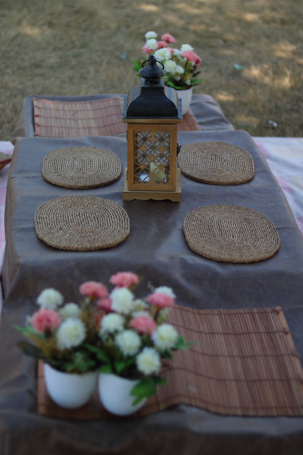 brown and beige ceramic table decor on blue table cloth