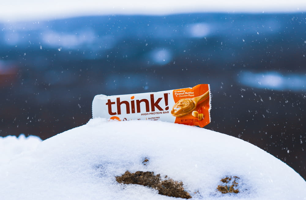 a bar of think sitting on top of a pile of snow