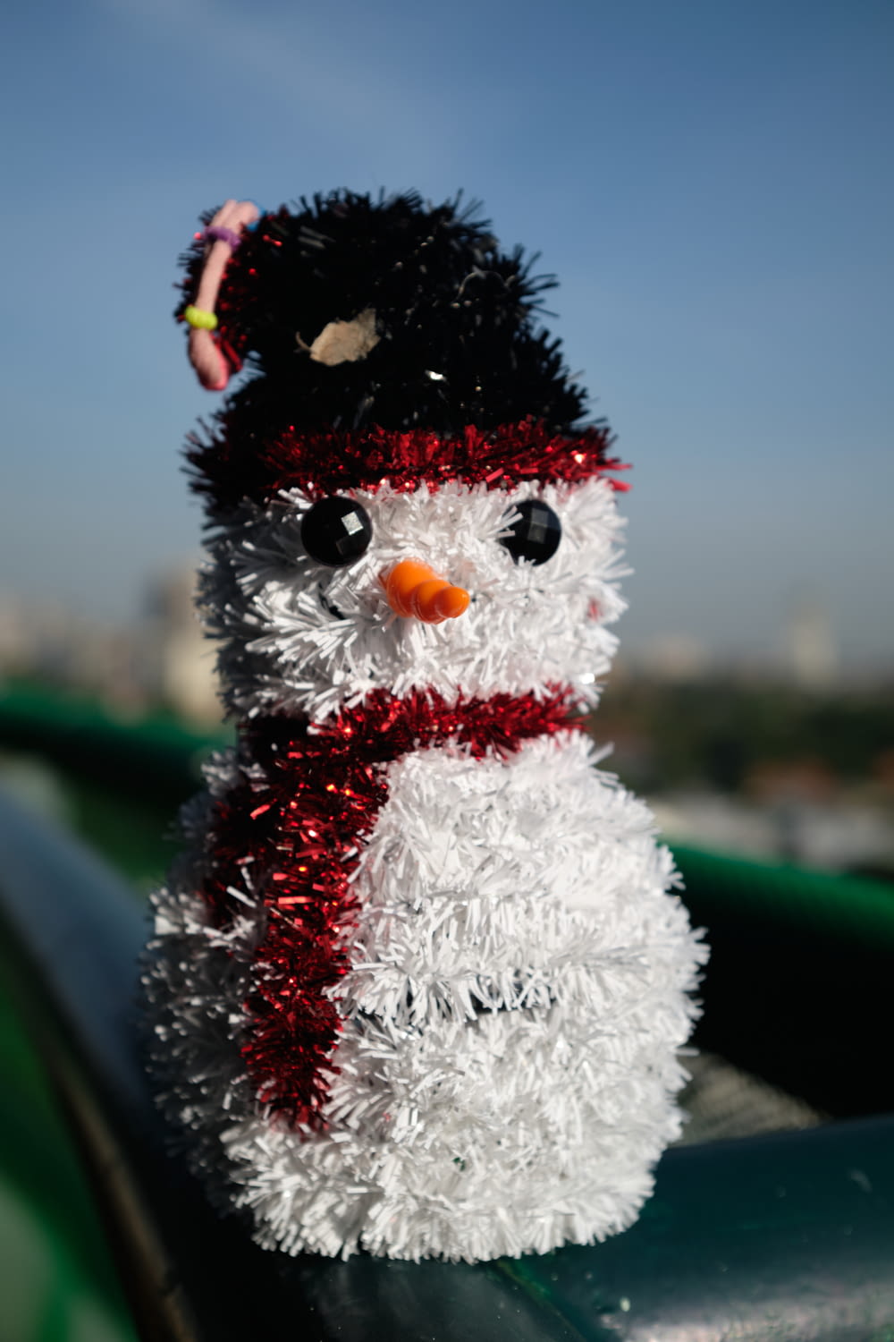 snowman in red and white scarf