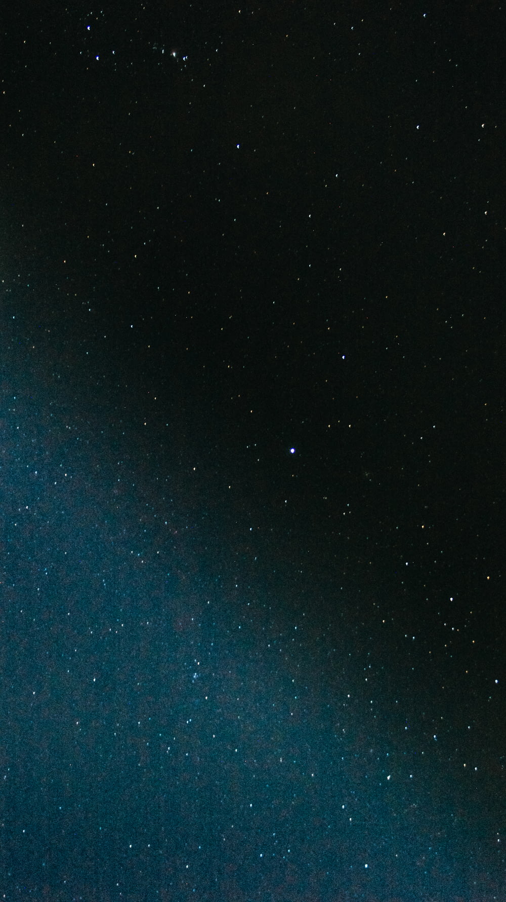 blue and black starry night sky