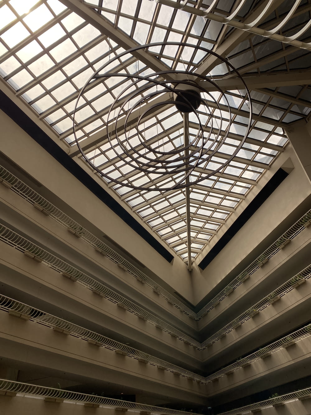 the ceiling of a building with a glass roof