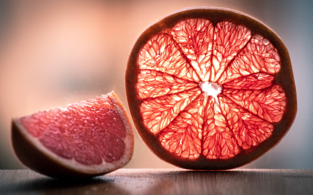 a grapefruit cut in half on a table