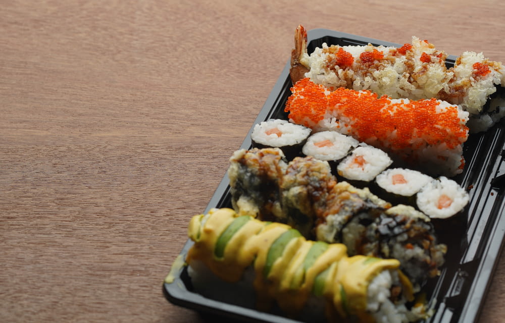 sushi on white and blue ceramic tray