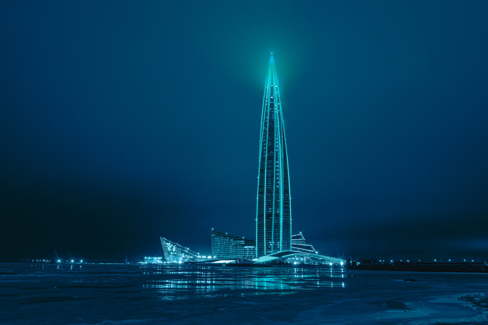 white and blue tower during night time
