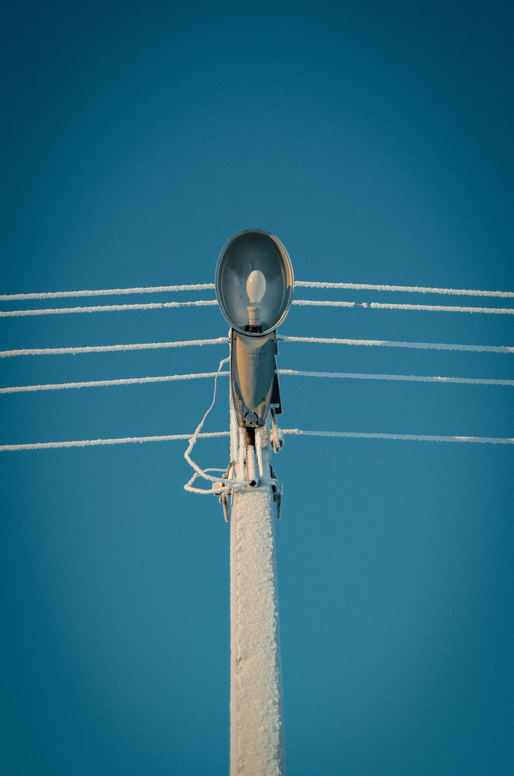 grey street light under blue sky during daytime