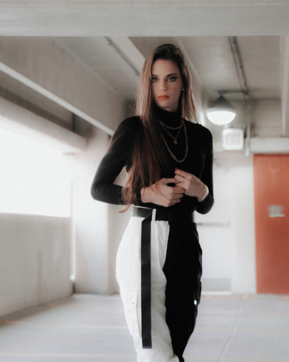 woman in black long sleeve shirt and black pants standing