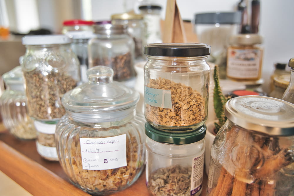 clear glass jars with brown and white seeds