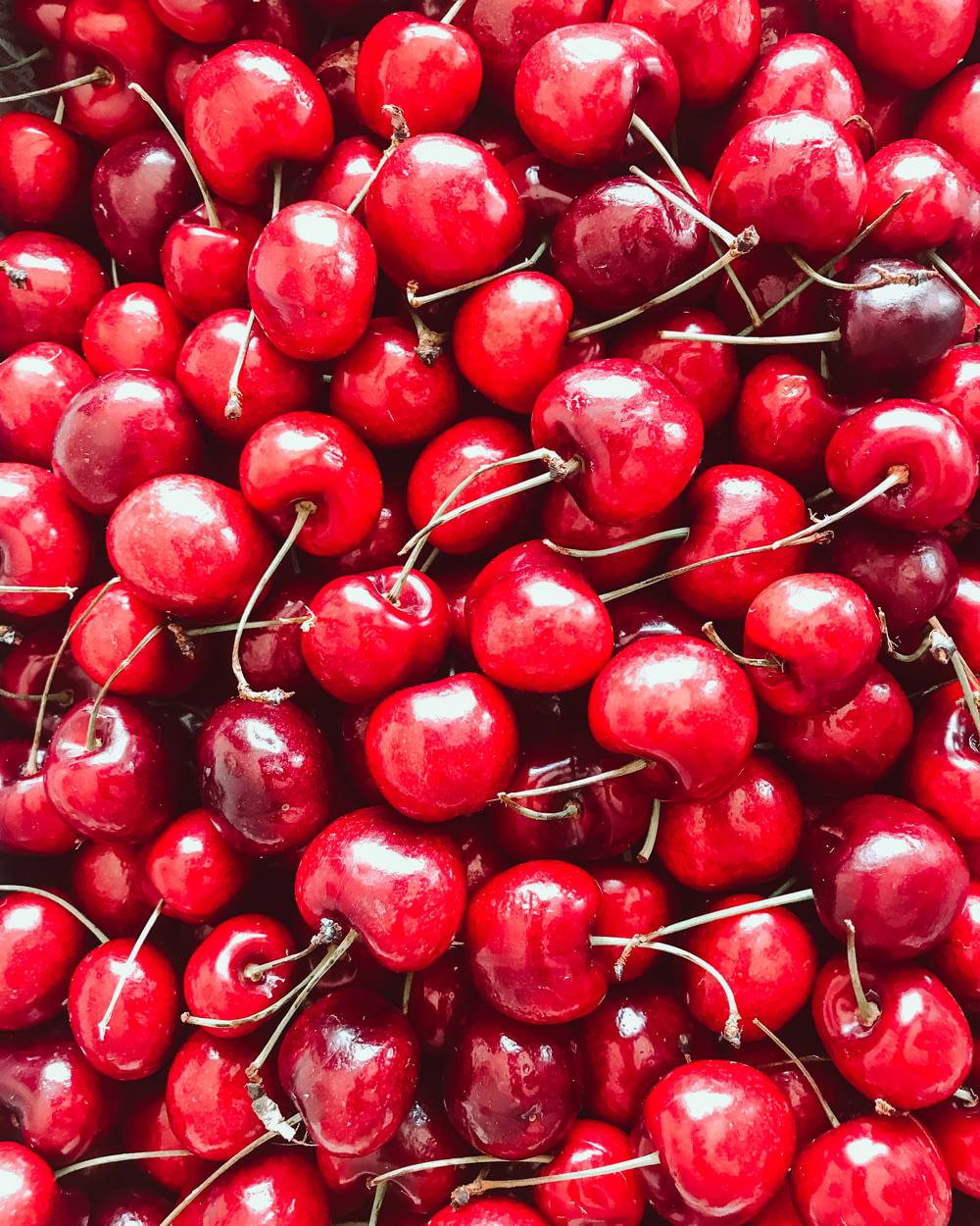 red cherries in close up photography