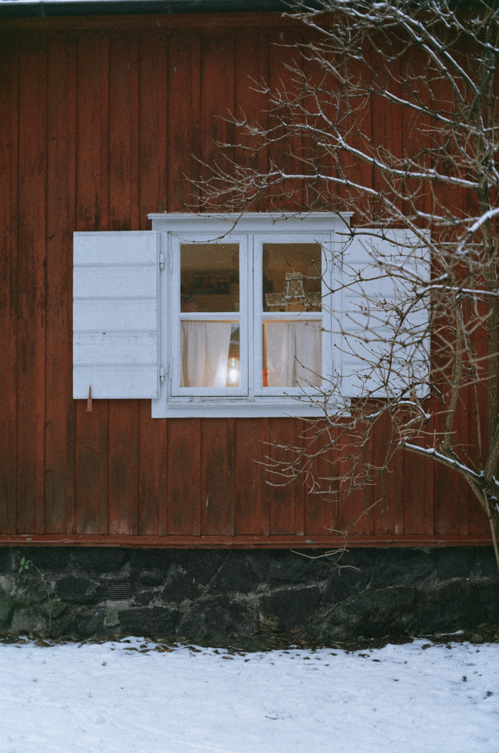 white wooden window frame on brown wooden wall