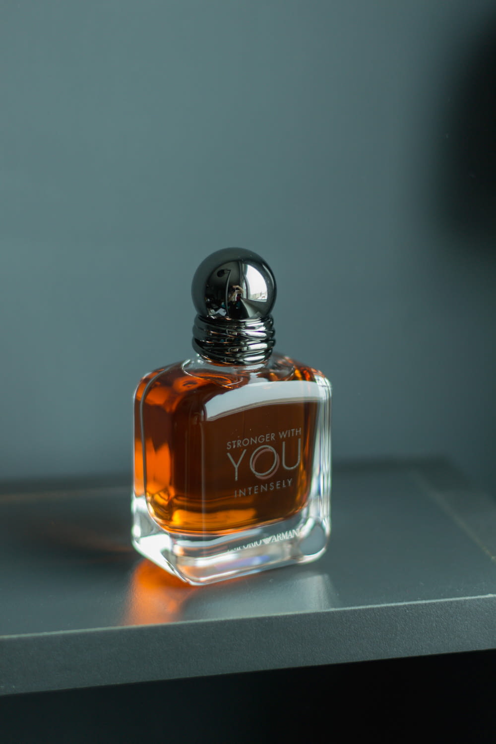 a bottle of perfume sitting on top of a table