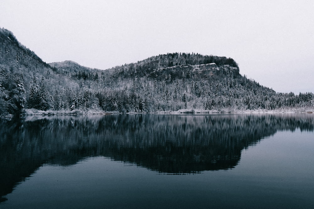 grayscale photo of lake and mountain