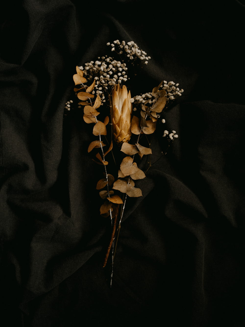 white flowers on black textile