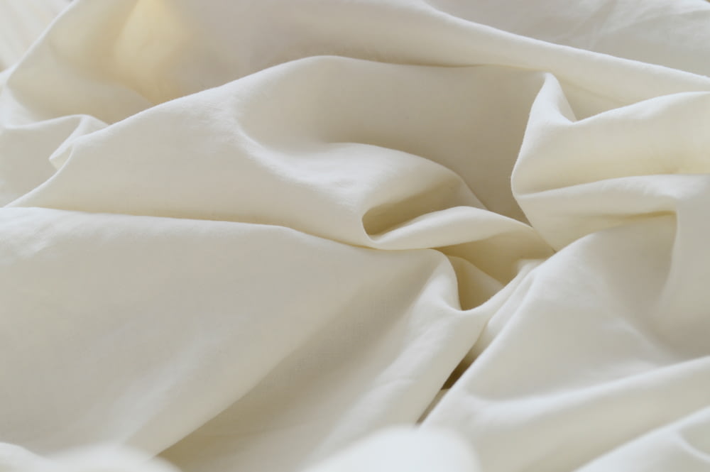 white textile in close up photography