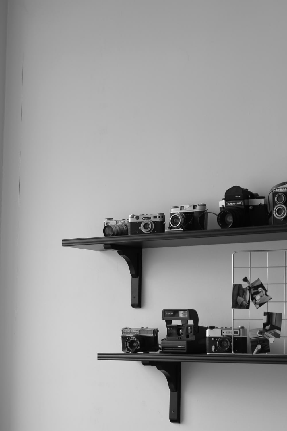 black and gray camera on wall rack