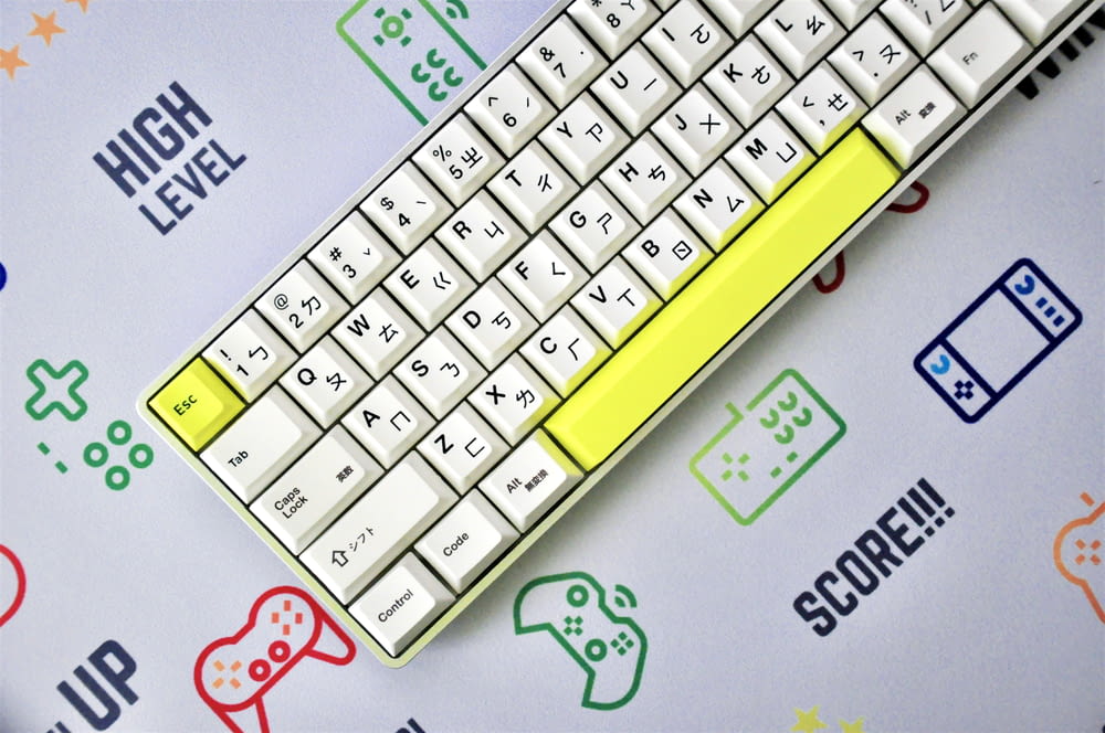 yellow and white keyboard on blue and white surface