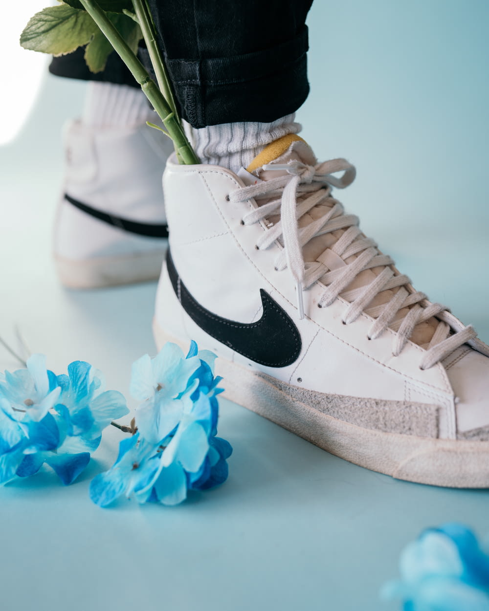 white and black nike high top sneakers