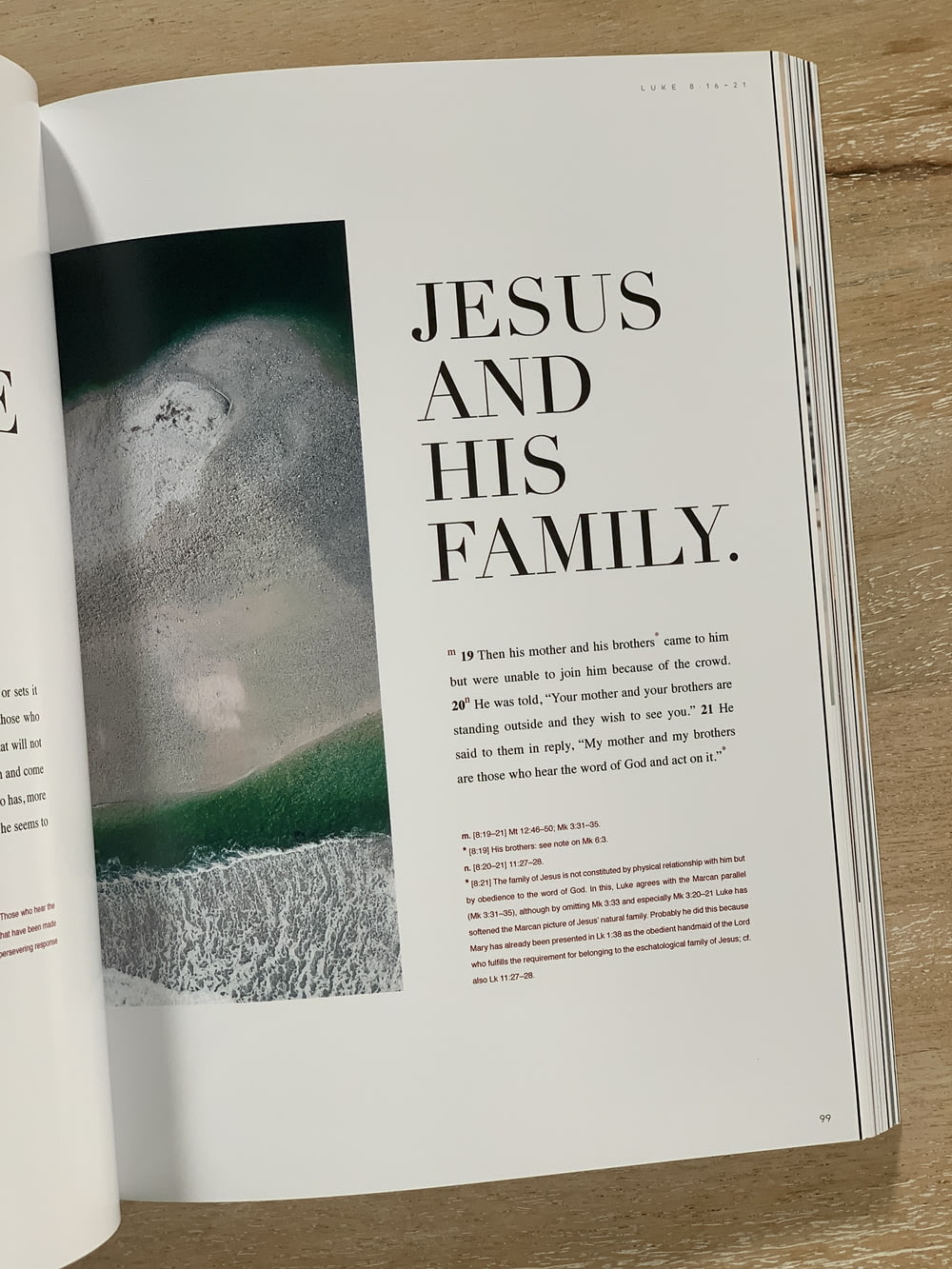 a book opened to a page with a picture of jesus and his family