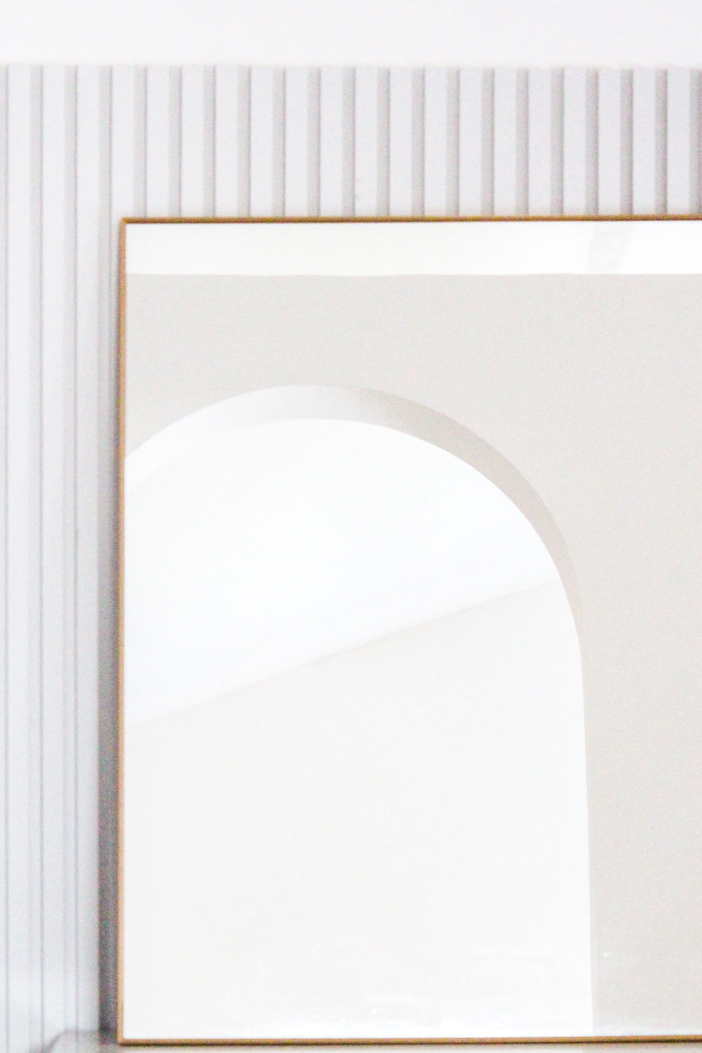 brown wooden frame on white wall