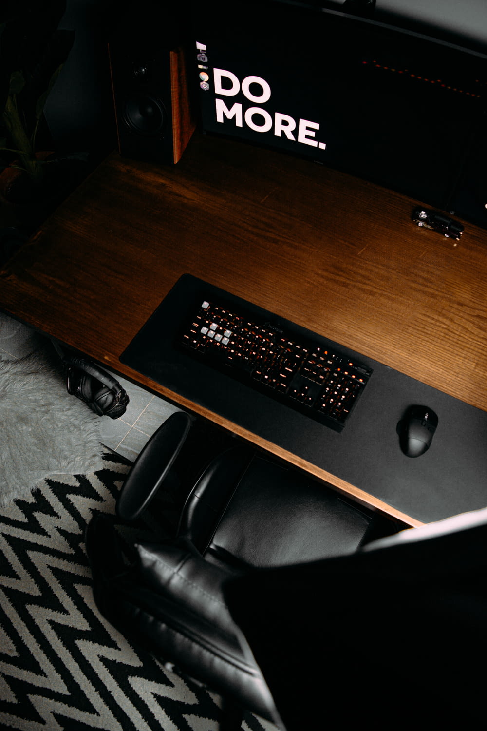 black computer keyboard on brown wooden desk