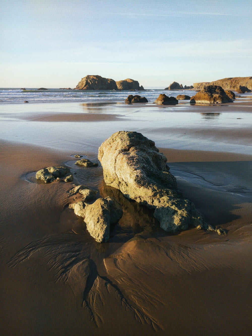 brown rock formation on sea shore during daytime