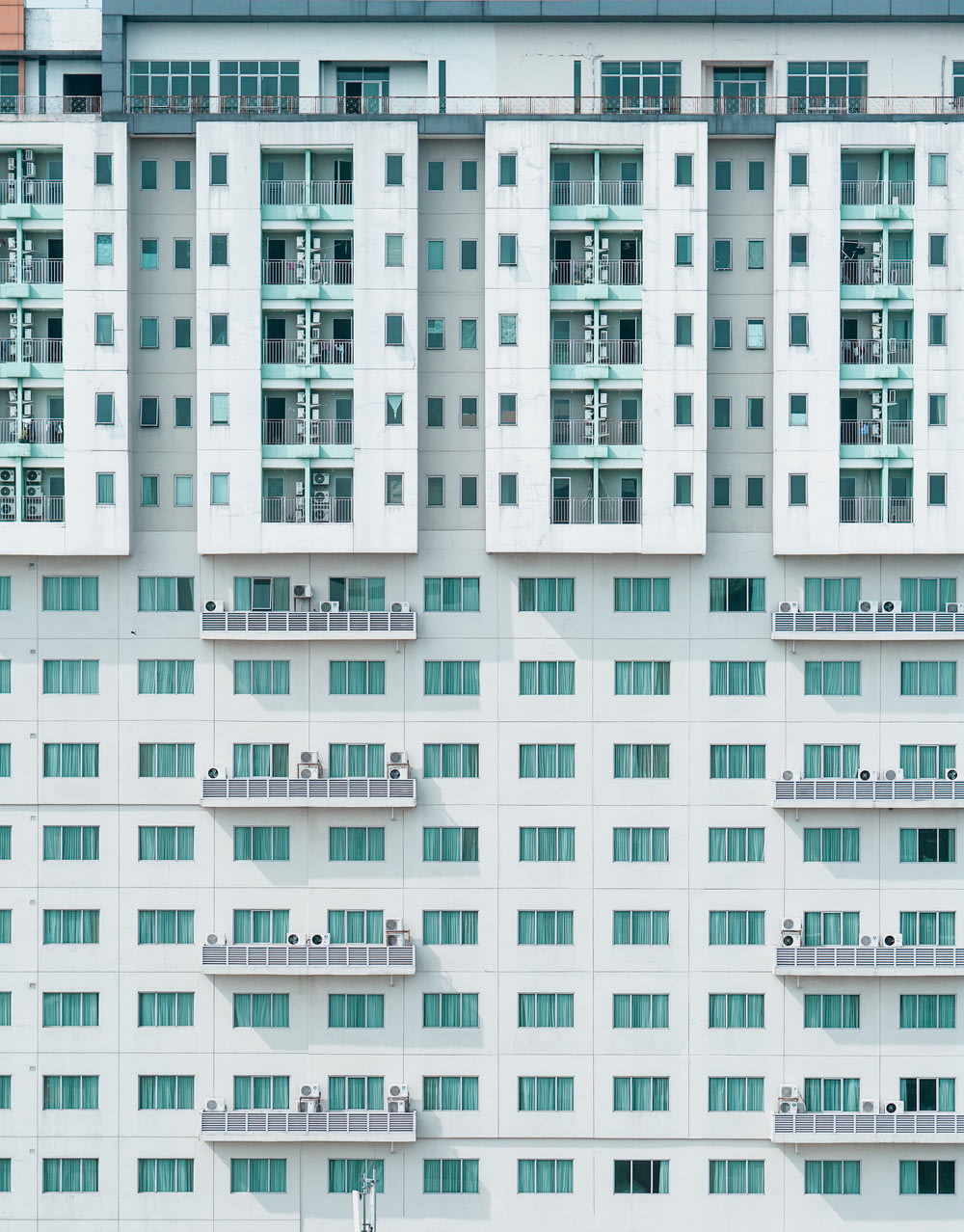 white and teal concrete building