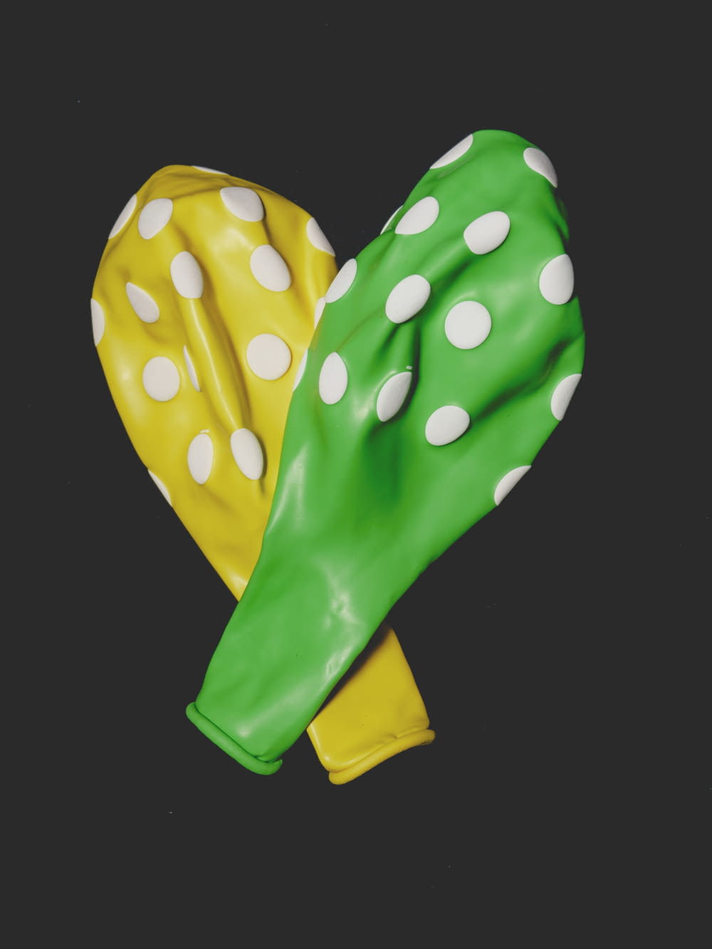 green and yellow heart balloon