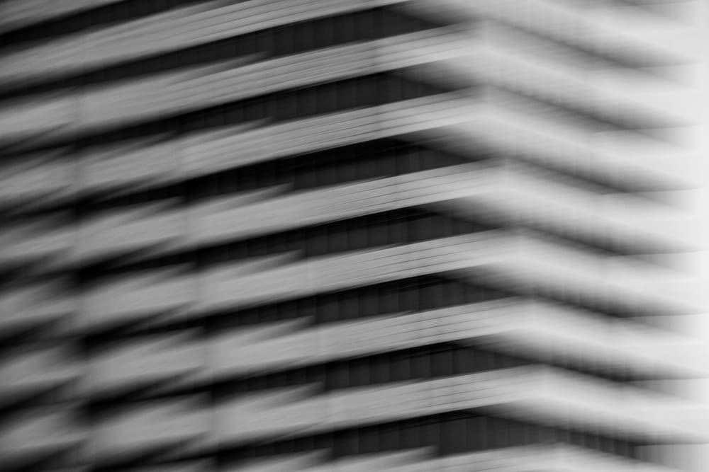 grayscale photo of a window blinds