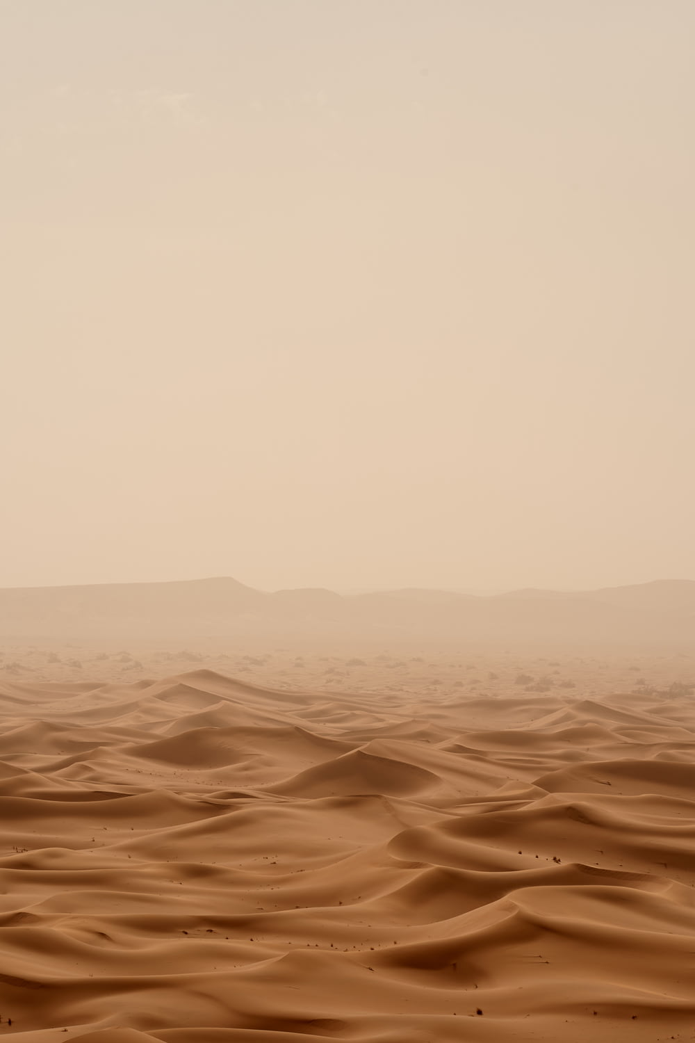 desert under white sky during daytime