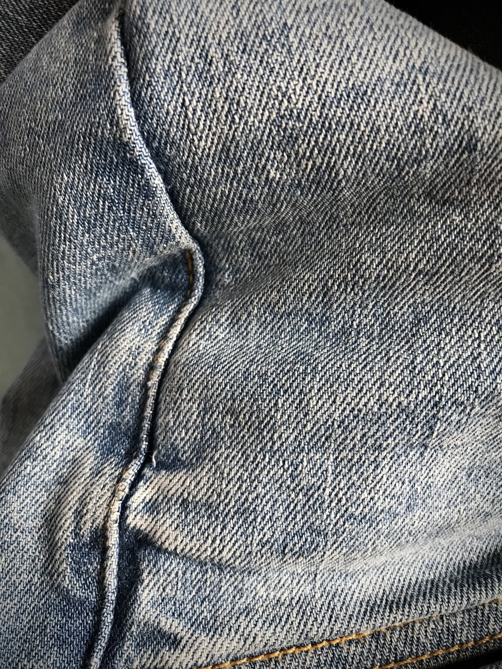 person in blue denim jeans