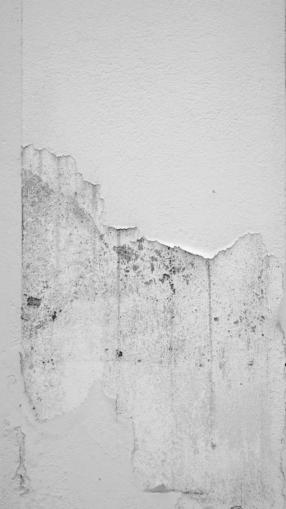 white concrete wall with hole