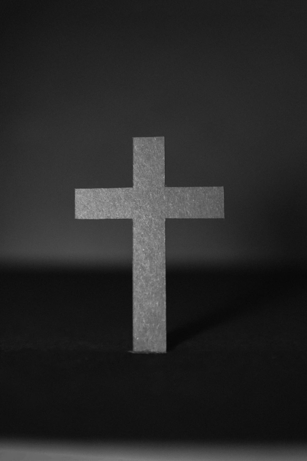white cross on black surface