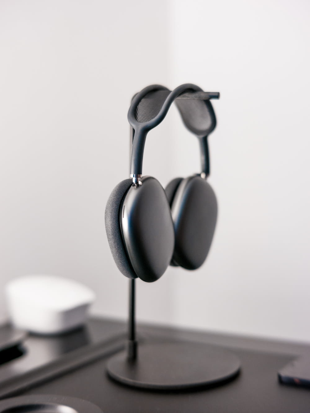 black and white headphones on white table