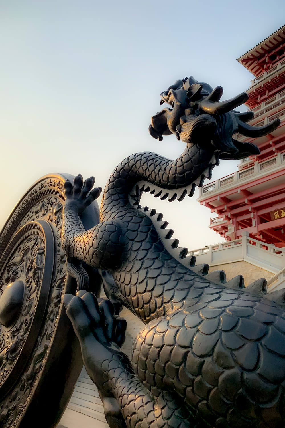 dragon statue under blue sky during daytime