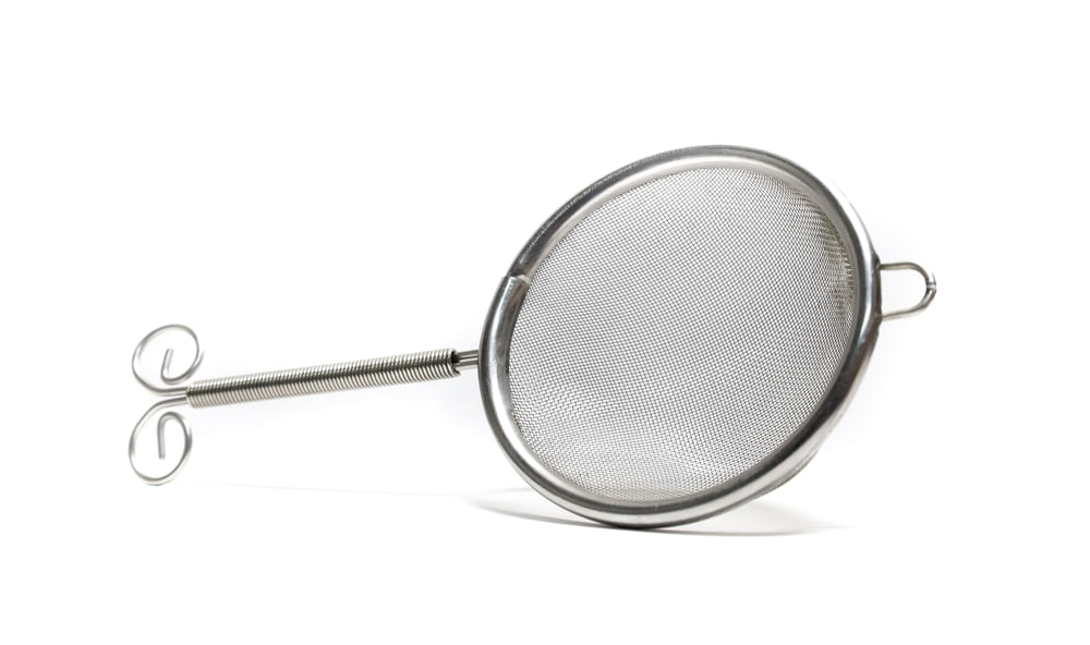 stainless steel strainer on white background