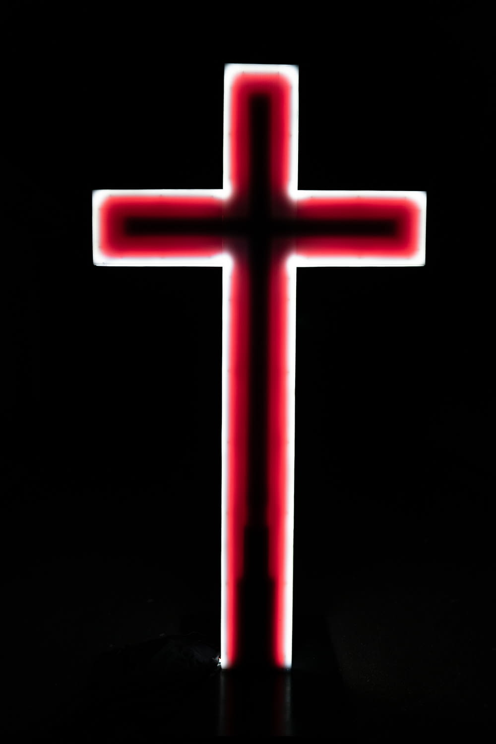 red cross with black background