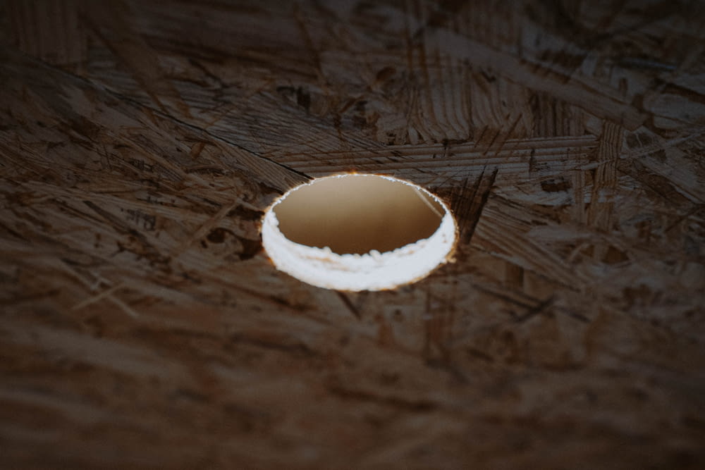 white round ornament on brown wooden table