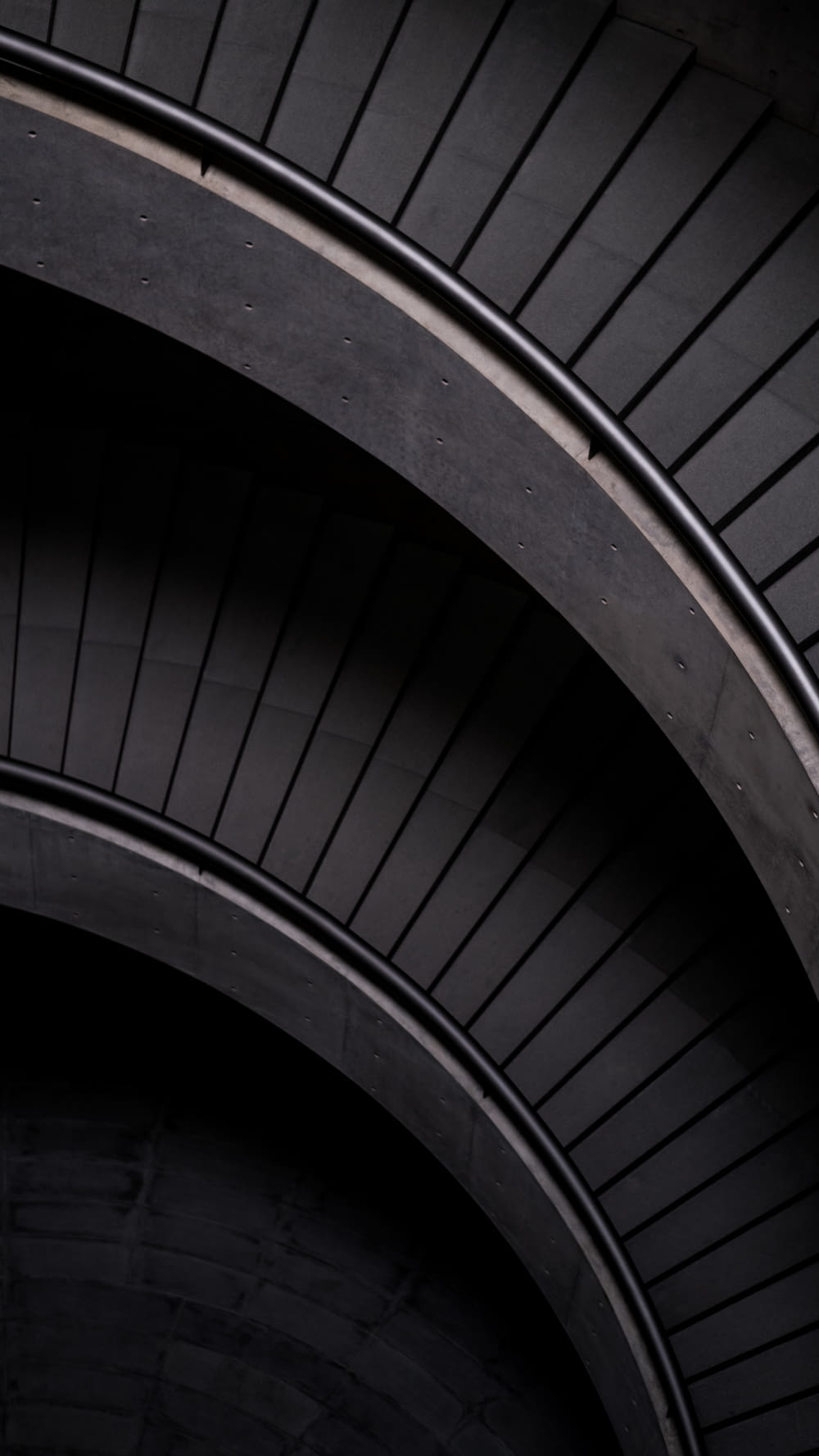 black spiral staircase with black metal railings
