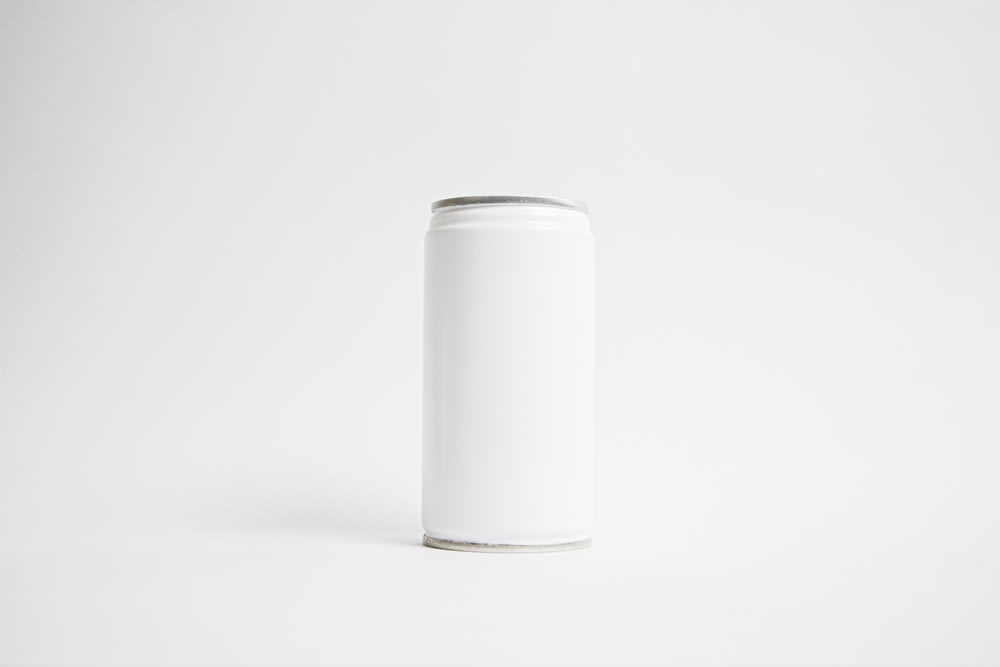 white cylindrical container on white surface