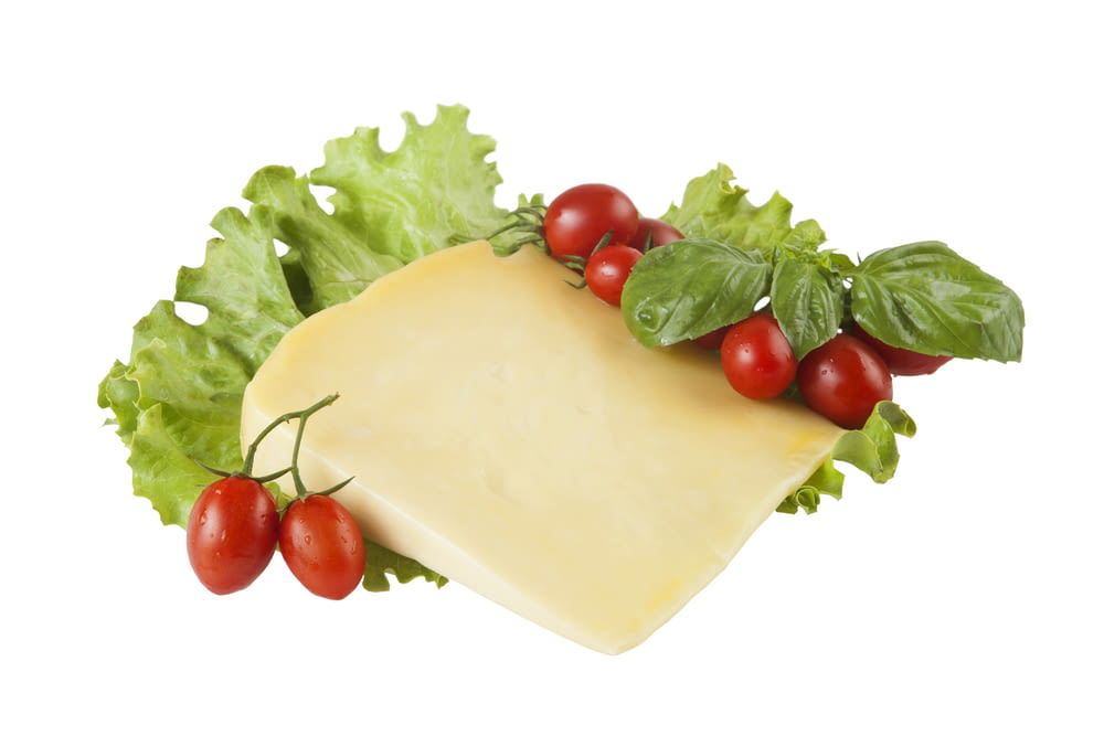 red tomatoes beside white cheese