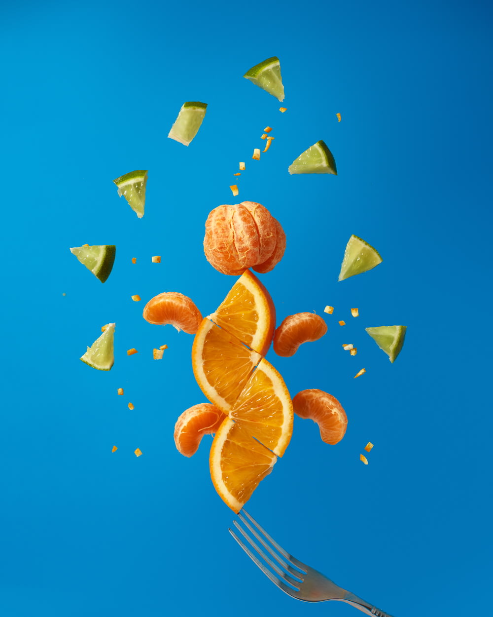 sliced orange fruits on blue surface