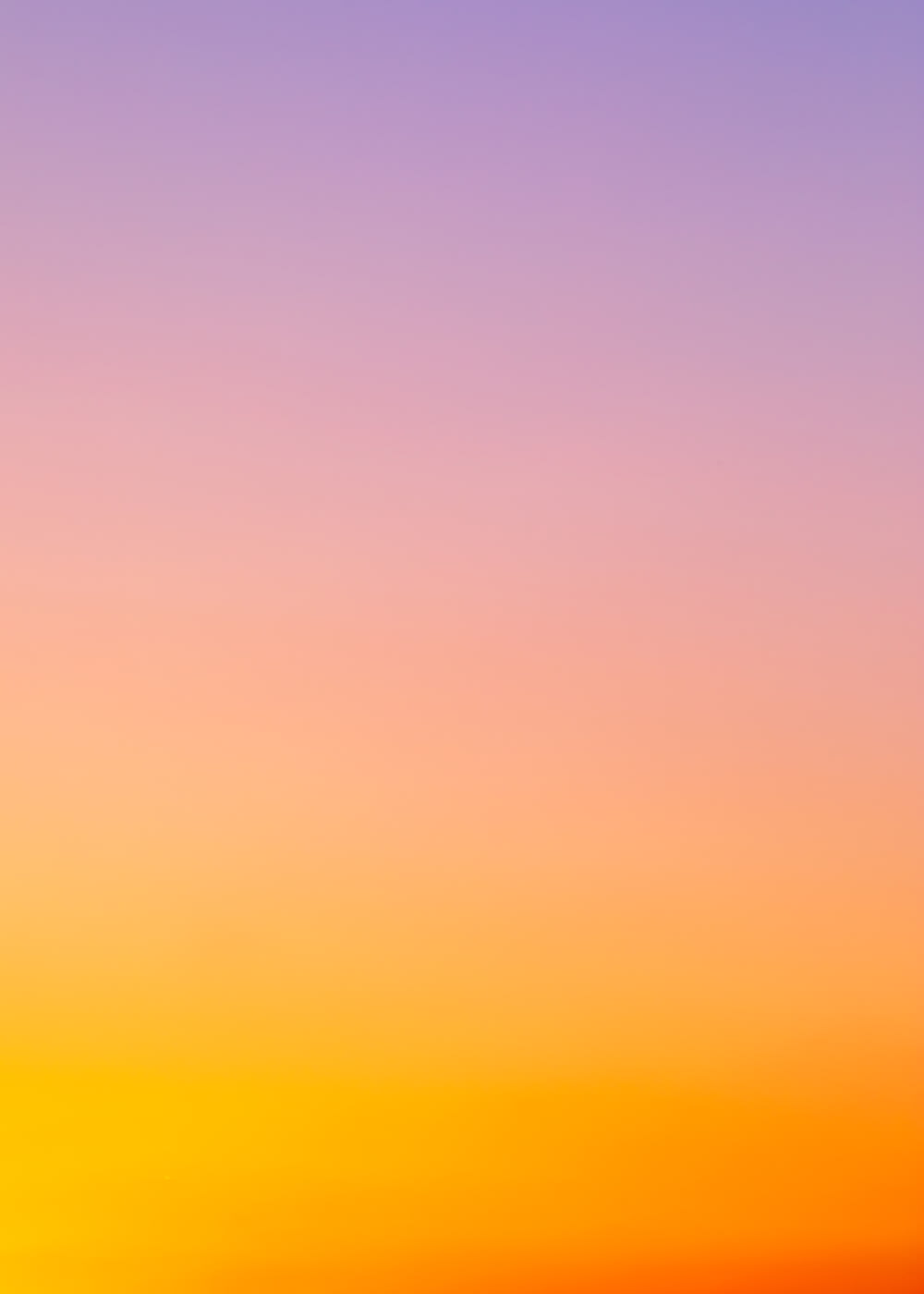 céu laranja e amarelo durante o pôr do sol
