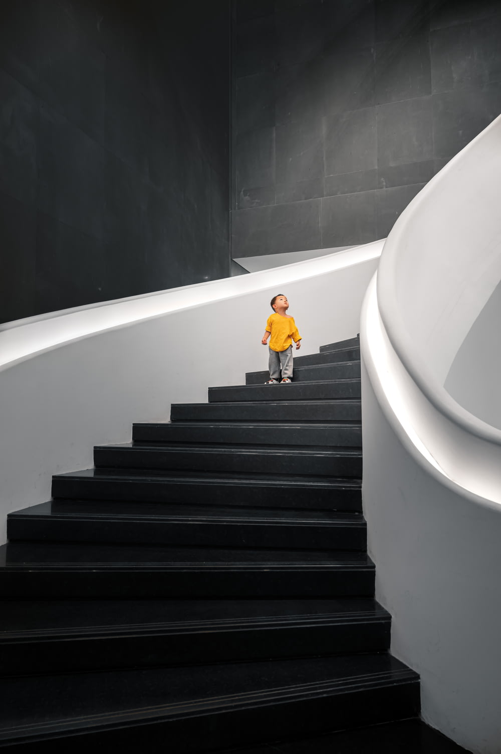 woman in yellow dress walking down the stairs