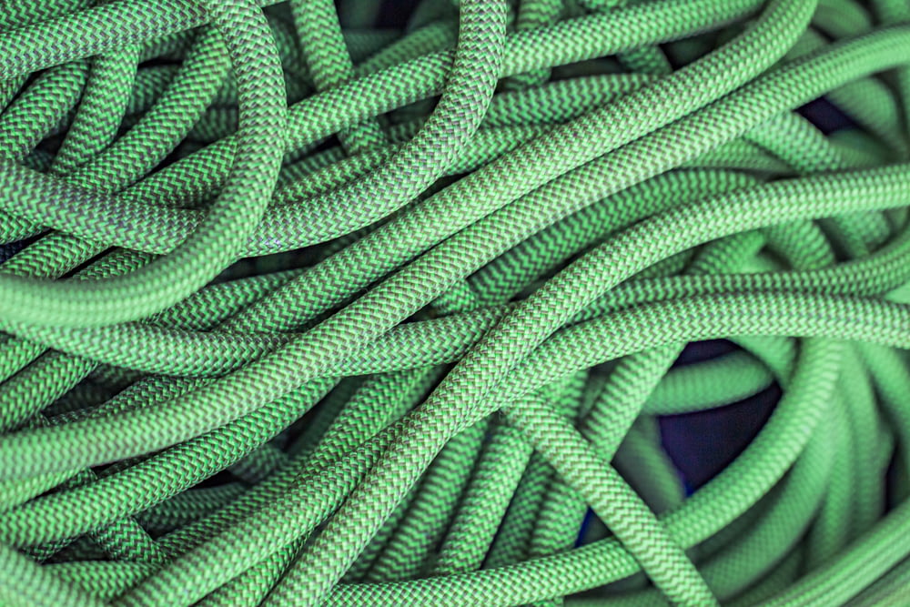 green rope on blue textile