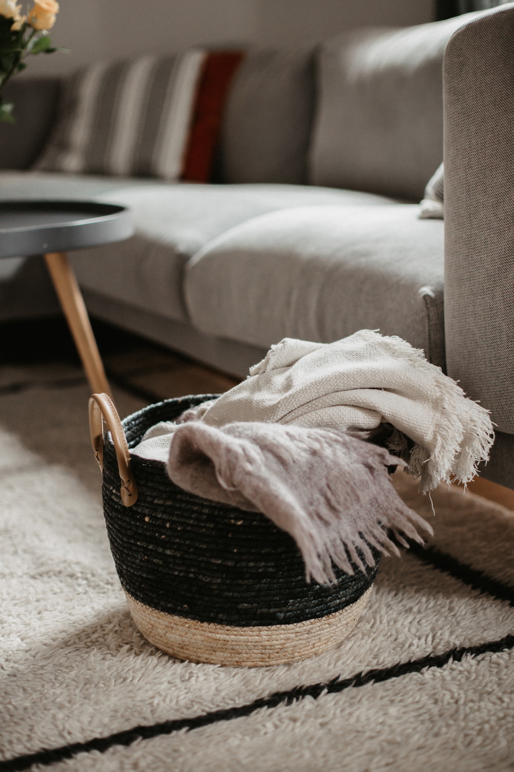white textile on brown woven basket